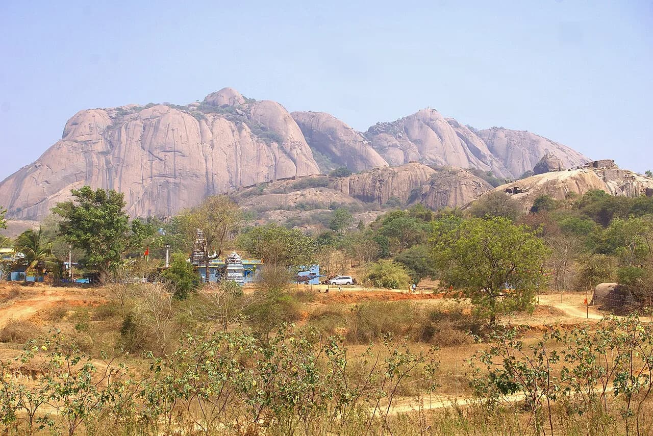 The broad granite face of Savandurga seen from the south.